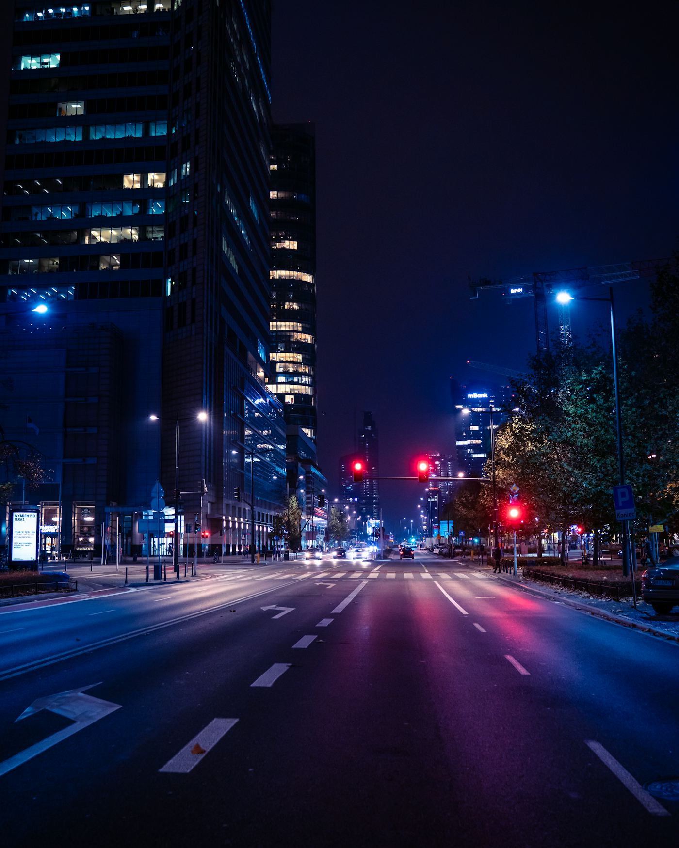 A neon-lit city street at night