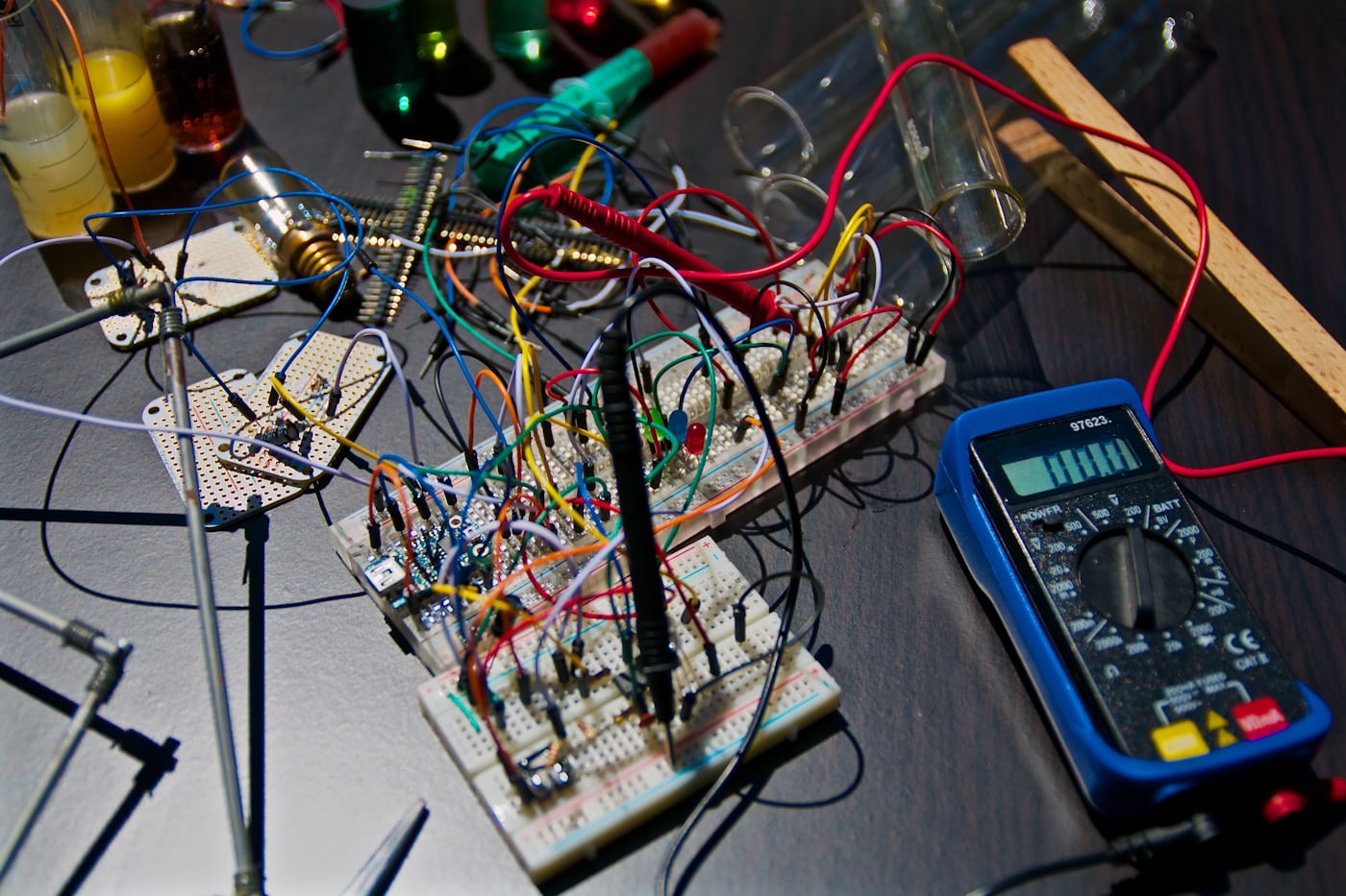 An electronics workbench with components and tools