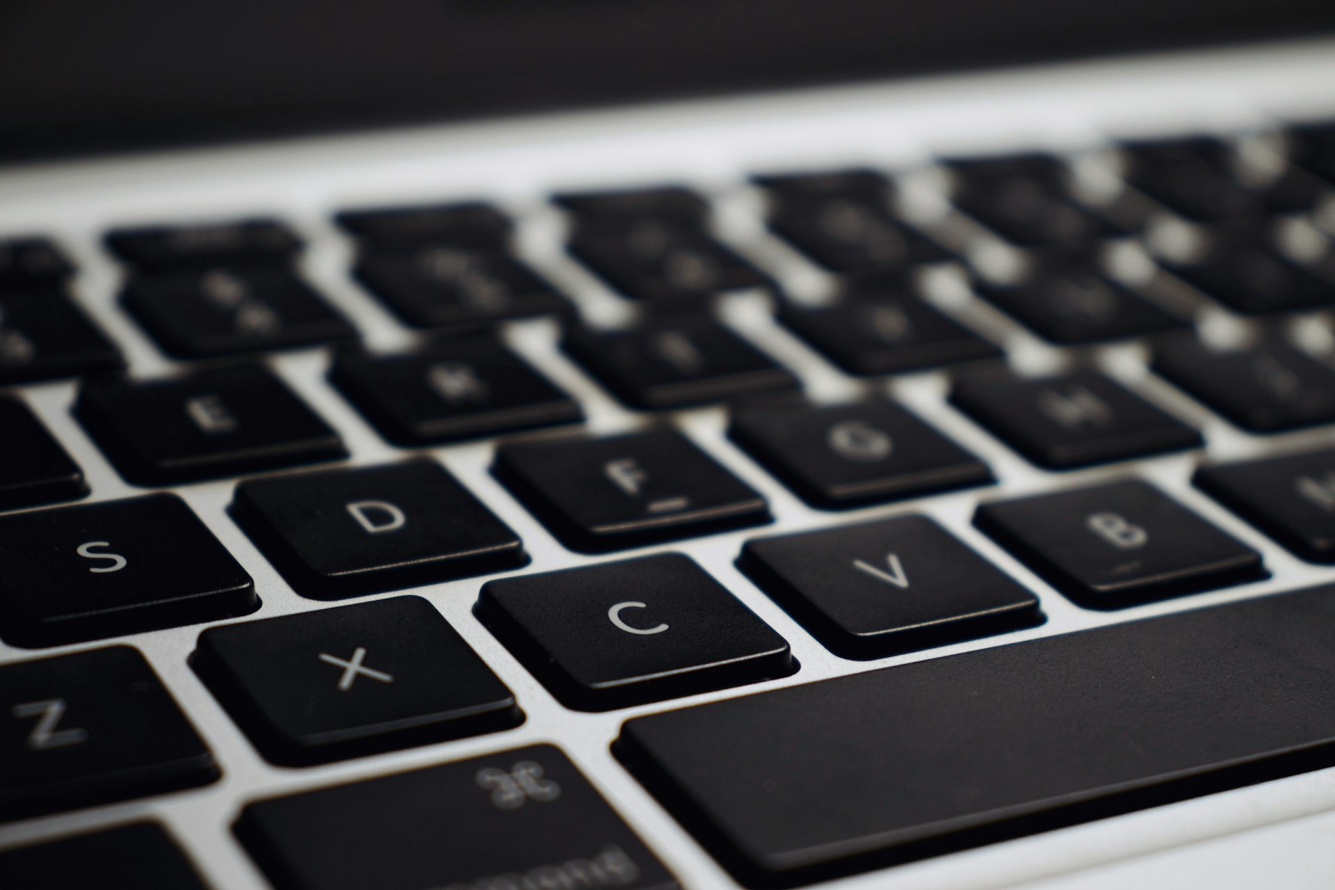 Black and silver laptop computer, closed
