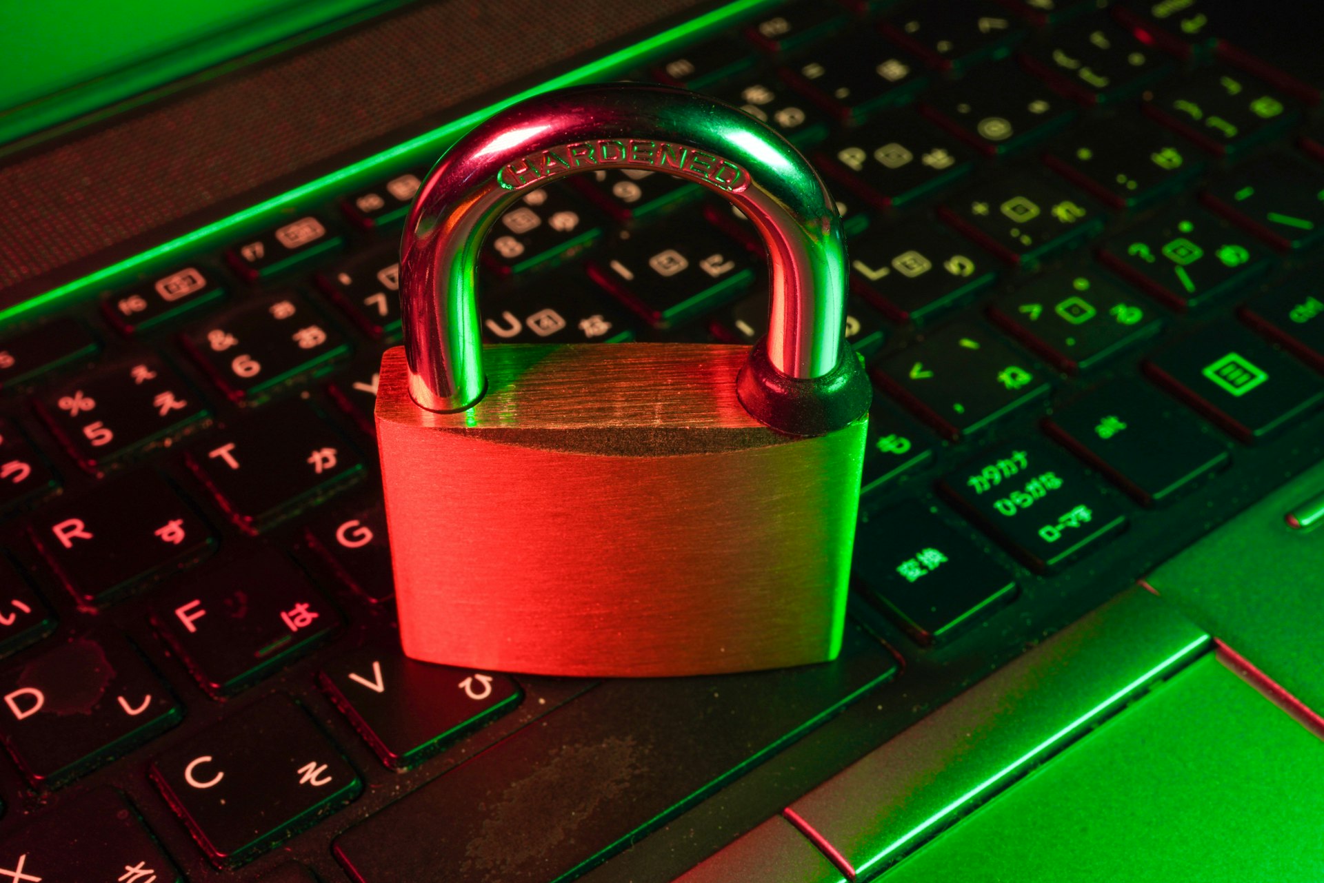 Red padlock on a black computer keyboard